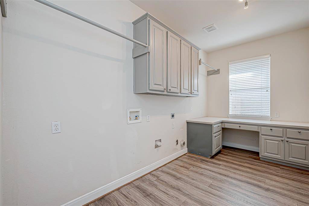 Large laundry room located off of the kitchen.
