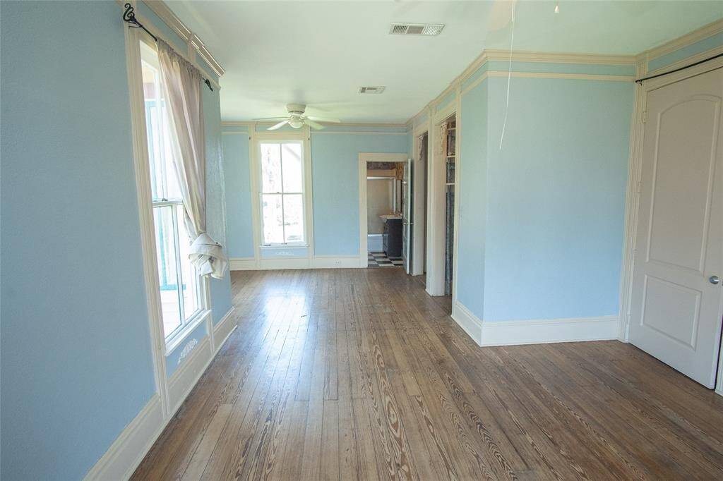 This lovely upstairs master bedroom has plenty of space and two ceiling fans!