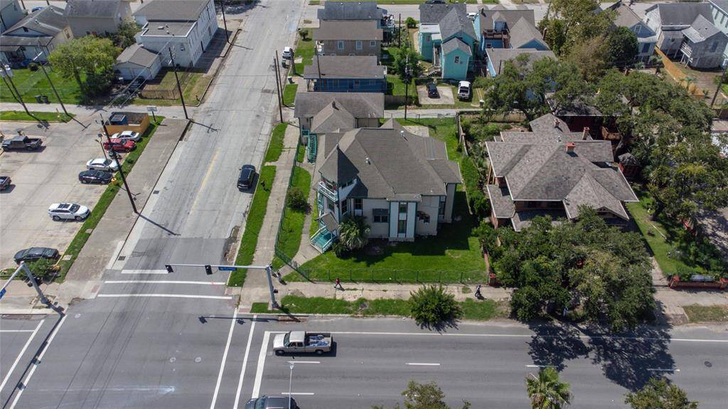 Palm trees and lush grass create a great landscape surrounding this home.