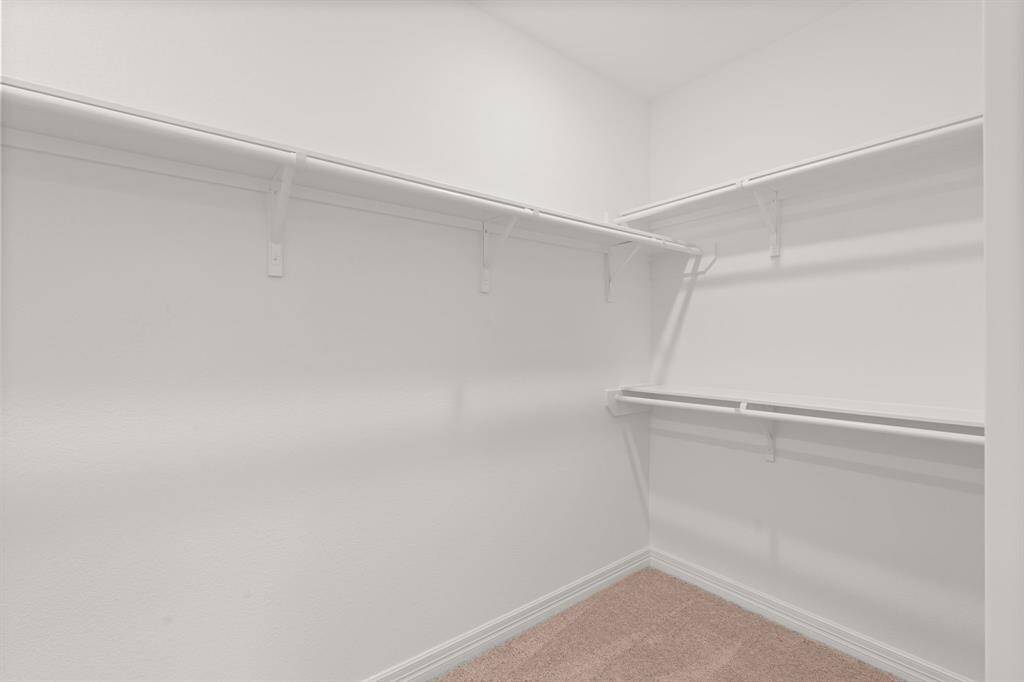 A view of your large primary walk-in Closet