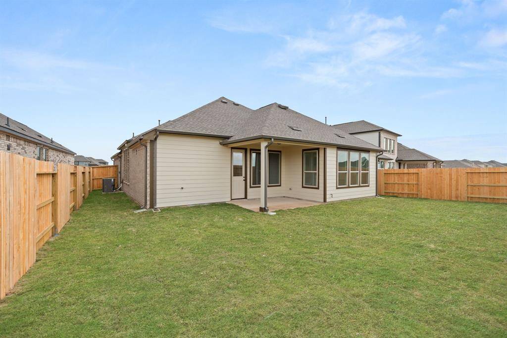 This backyard is perfect for family gatherings, social events, or simply unwinding in the fresh air.