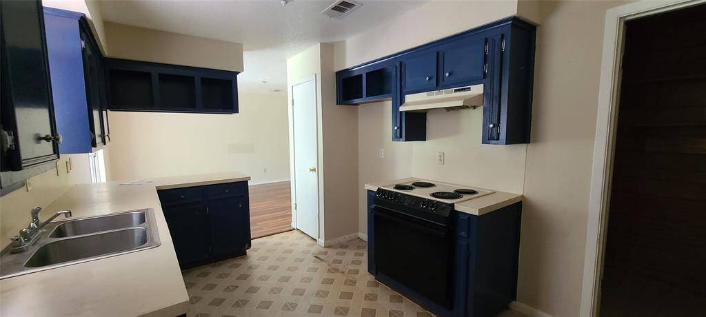 View of kitchen from breakfast area