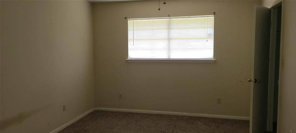 Another view of primary bedroom