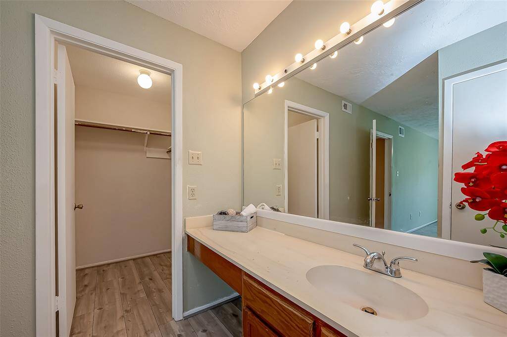 Primary Vanity area and one of the closet.