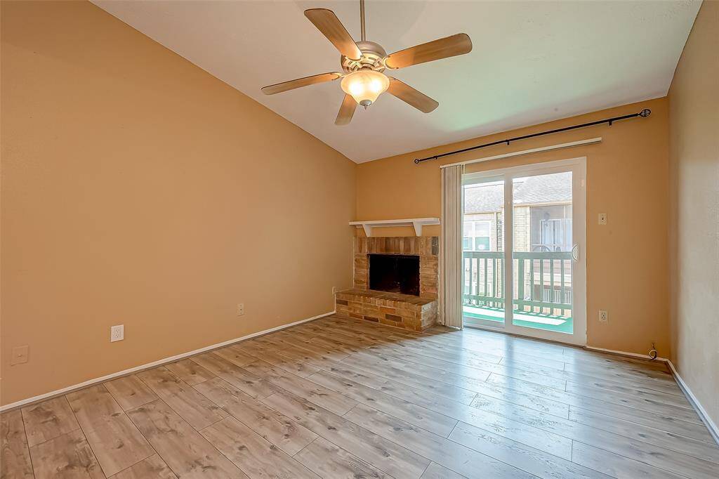 Spacious relaxing Living room with a fire place .