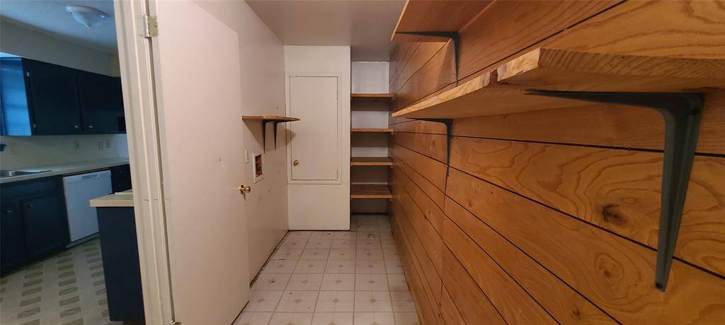 Utility room can easily be utilized as a walk in pantry as well as a utility room