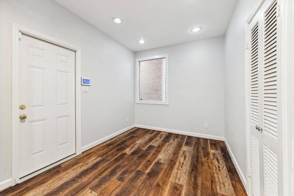 Off the Breakfast Room is the door to access the oversized two-car garage. To the right is a walk-in pantry.