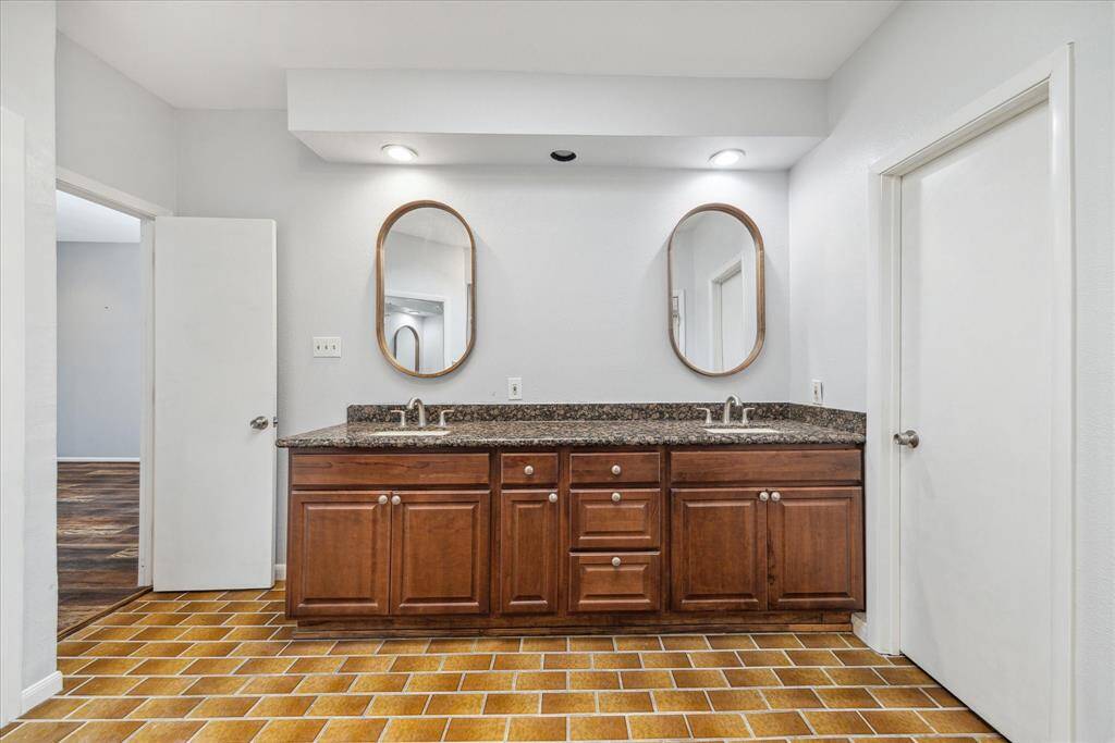 Double Vanity in the En Suite with designer mirror above.