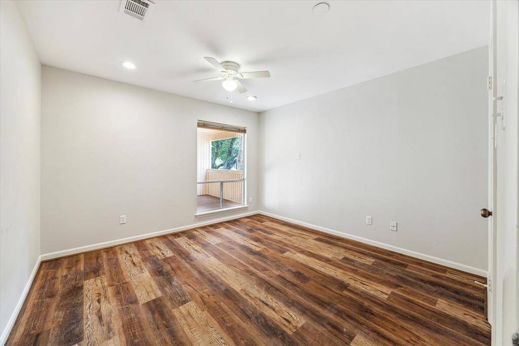 This angle of Family Room showcases the tall ceilings. (Virtually staged)