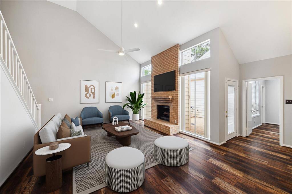 This cozy Den is at the top of the stairs. Note the handsome ceiling fan, along with recessed canned lighting. (Virtually staged)