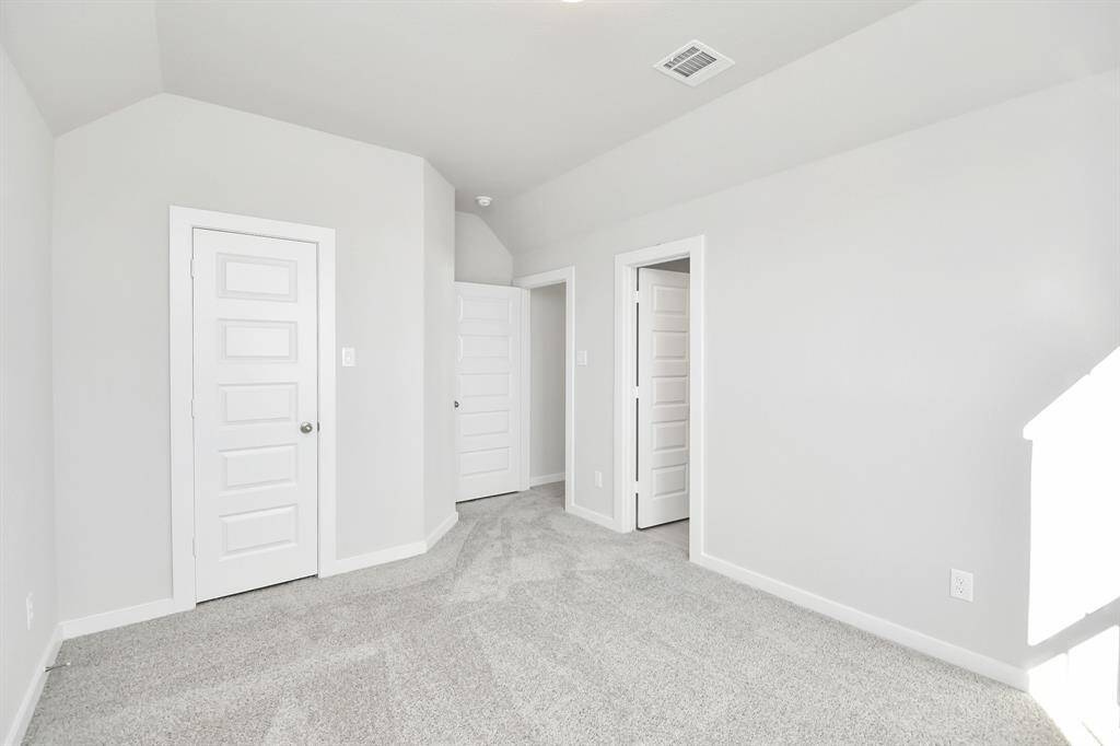 Generously sized secondary bedrooms featuring spacious closets, soft and inviting carpetingunderfoot, large windows allowing plenty of natural light, and the added touch of privacyblinds for your personal retreat.