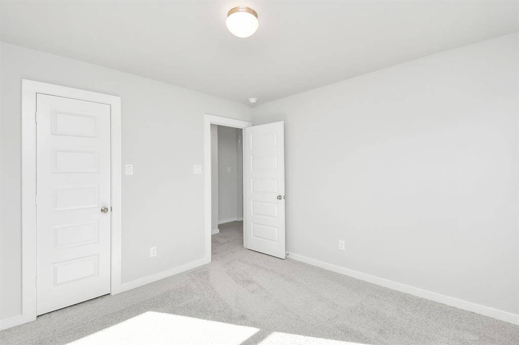 Generously sized secondary bedrooms featuring spacious closets, soft and inviting carpetingunderfoot, large windows allowing plenty of natural light, and the added touch of privacyblinds for your personal retreat.
