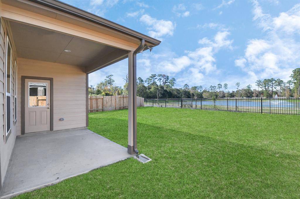 Experience outdoor living at its finest on this expansive covered patio,thoughtfully designed for BBQs and delightful outdoor dining.