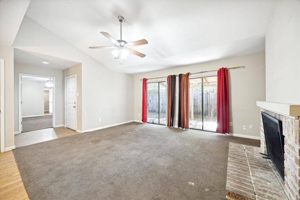 Living room has two sets of doors out to the patio.