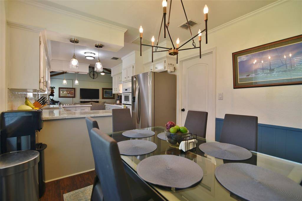 Dining area with updated lighting fixture....