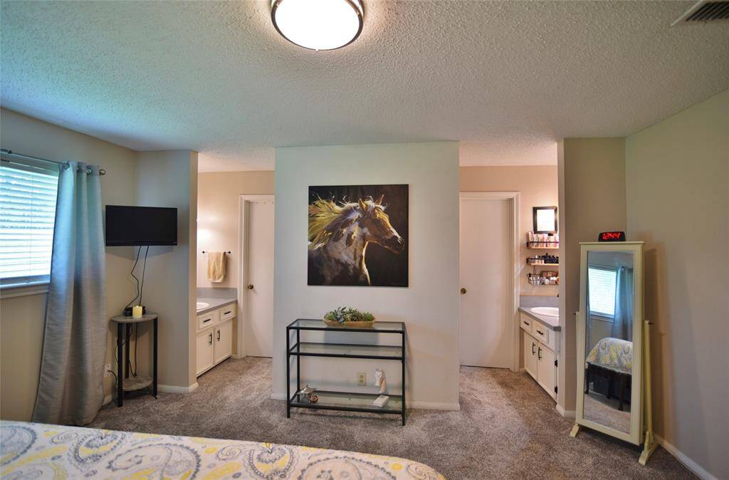 View in bedroom of the two vanity and closet areas....