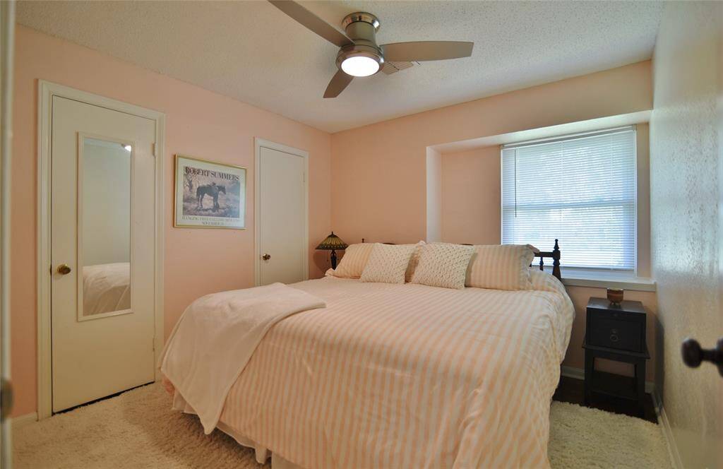 Secondary bedroom with lighted fan, extended window ledge and spacious closet areas.....