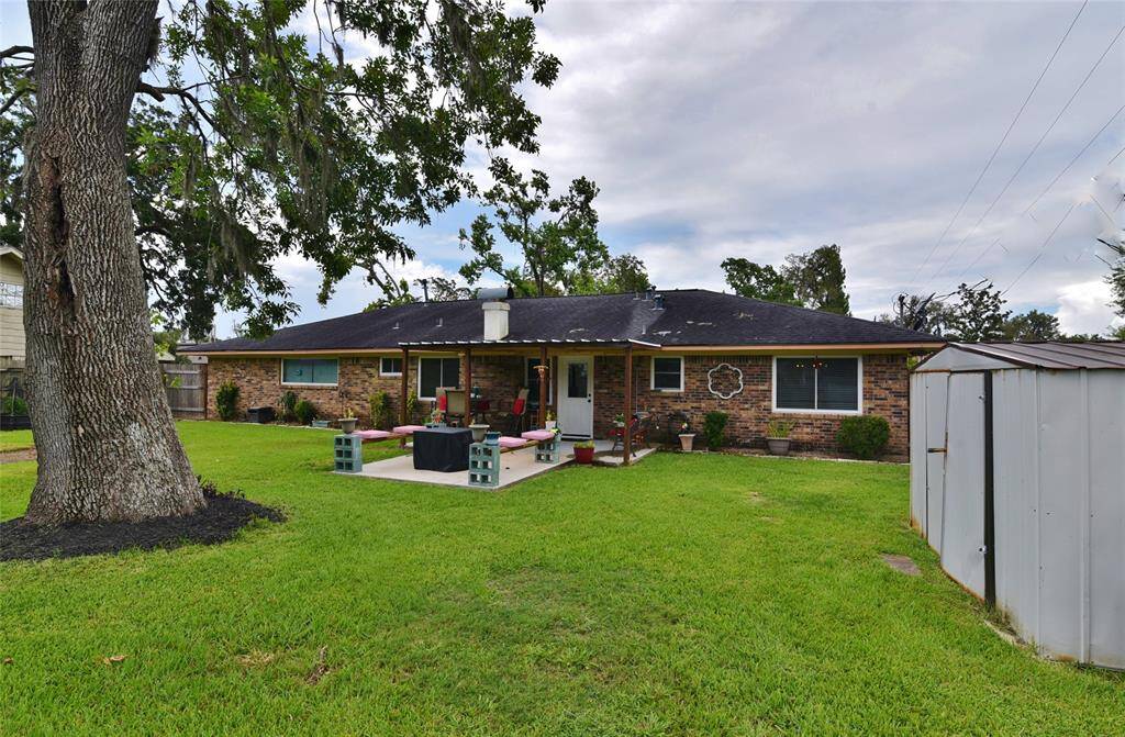 Charming ranch style home, mature landscape beds, and plenty of room for fun and play!