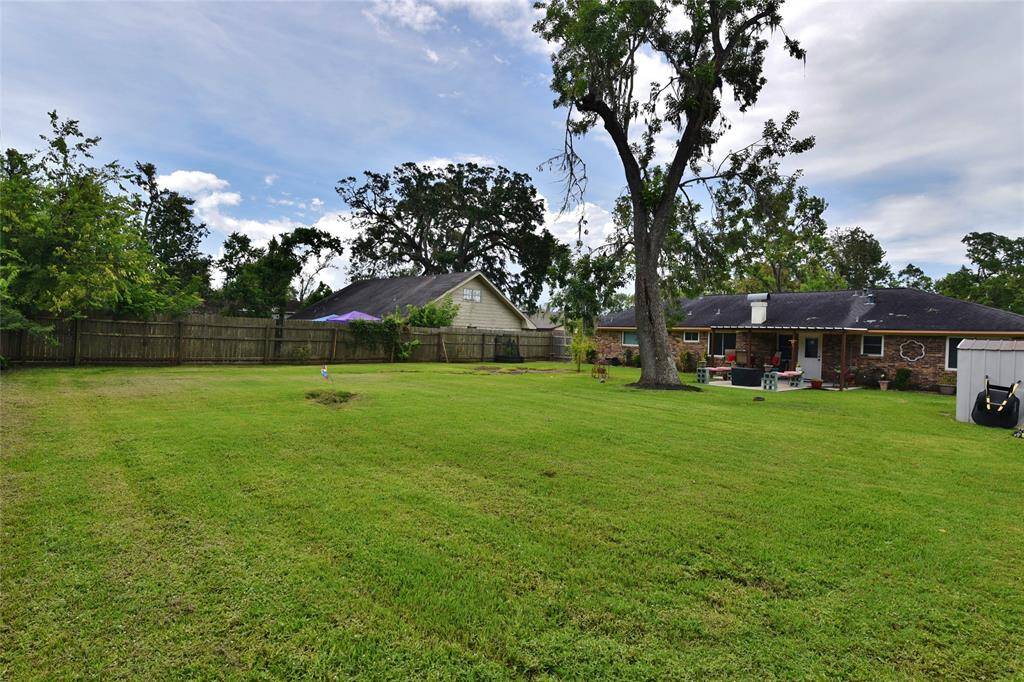 Extra large lot with plenty of room to run, play, have family outings, or even put in a pool! Storage shed will remain with property....