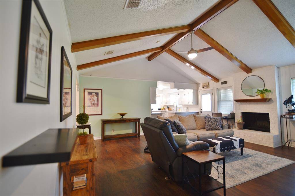 Love the high cathedral ceiling with beam accents in the spacious family room....