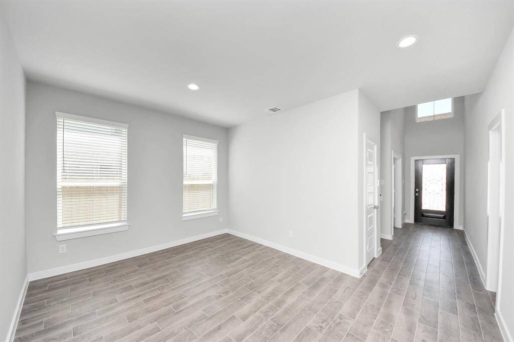 Make memories gathered around the table with your family and friends! This spacious dining room features elegant flooring, custom paint, and adjacent to family room and kitchen for open concept feel.