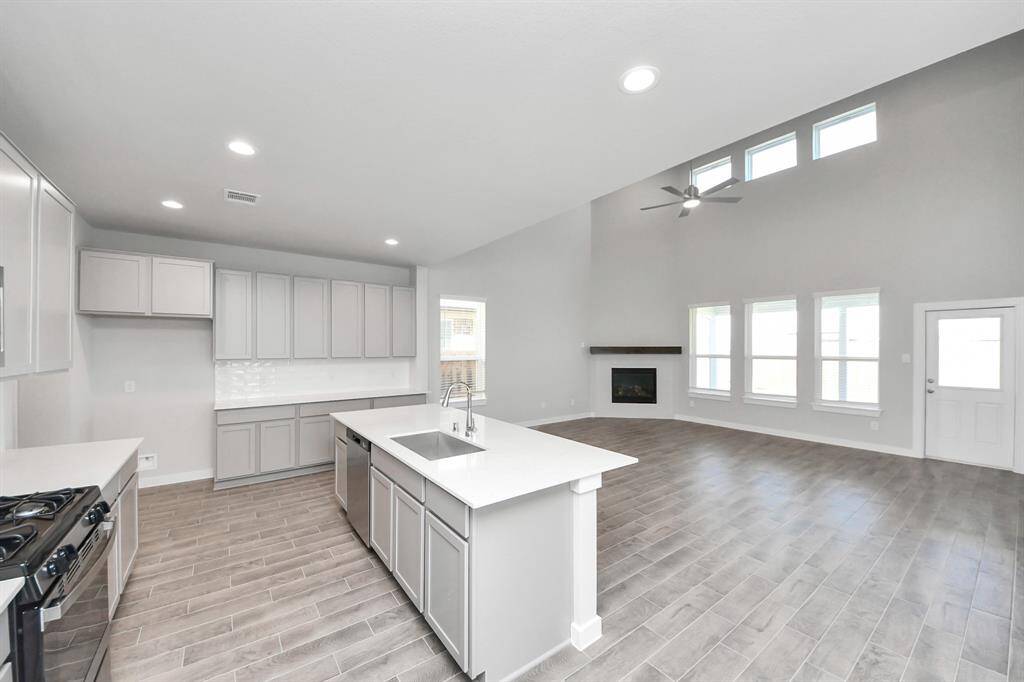 All of this overlooks your expansive family room, creating a perfect space for culinary delights and family gatherings.