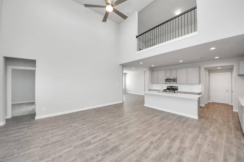 Embrace the warmth and comfort of this inviting family room, flooded with natural light!