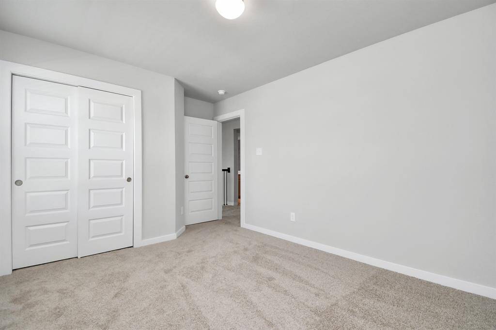Let this space serve as an additional living area or game room, possibilities are endless.  Sample photo of completed home with similar plan. As built color and selections may vary.
