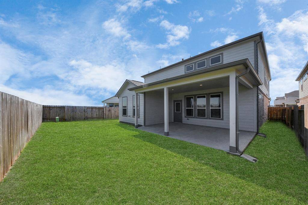 Come and see this spacious backyard with its beautiful covered patio. There is plenty of room for the kids to play and adults to relax. Perfect for your outdoor living space, patio furniture, bbq pit, and so much more. The possibilities are endless!