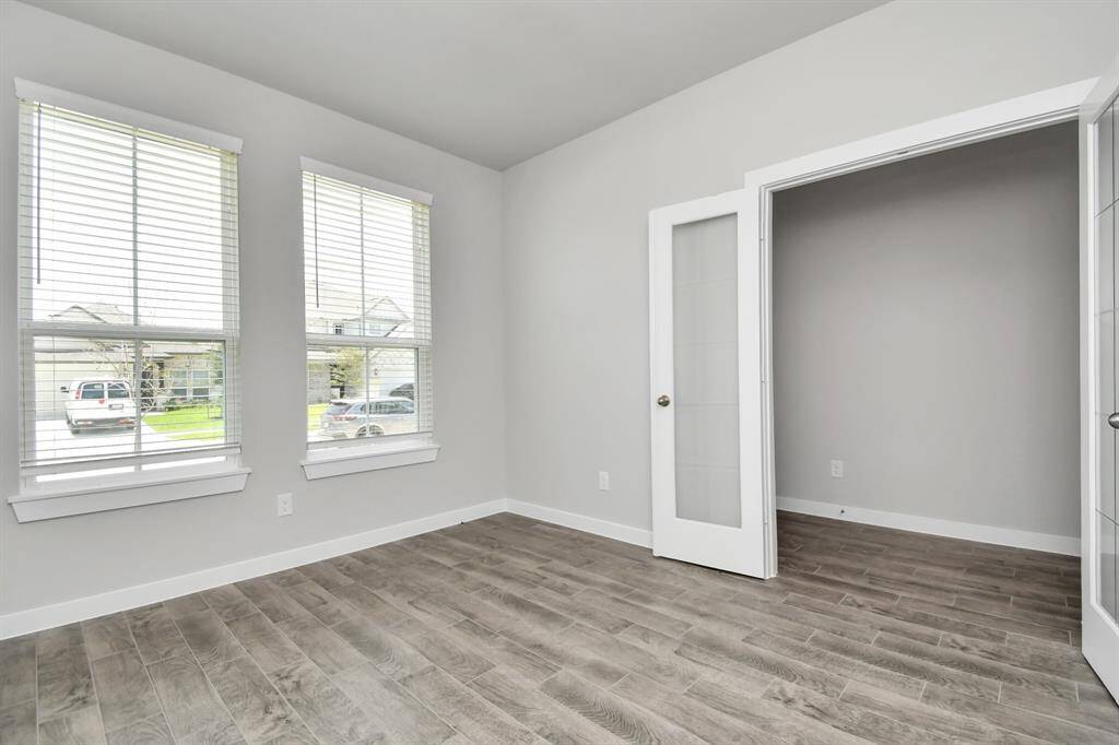An aerial view of a spacious subdivision lot, highlighting a well-maintained yard and a fully fenced perimeter, offering both privacy and expansive outdoor space.