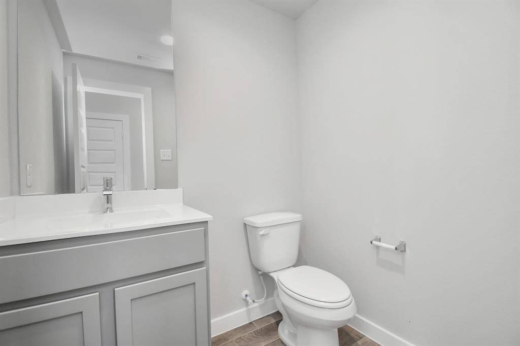Quietly nestled in front of the home is the sophisticated home office. Featuring custom paint and large window with privacy blinds.