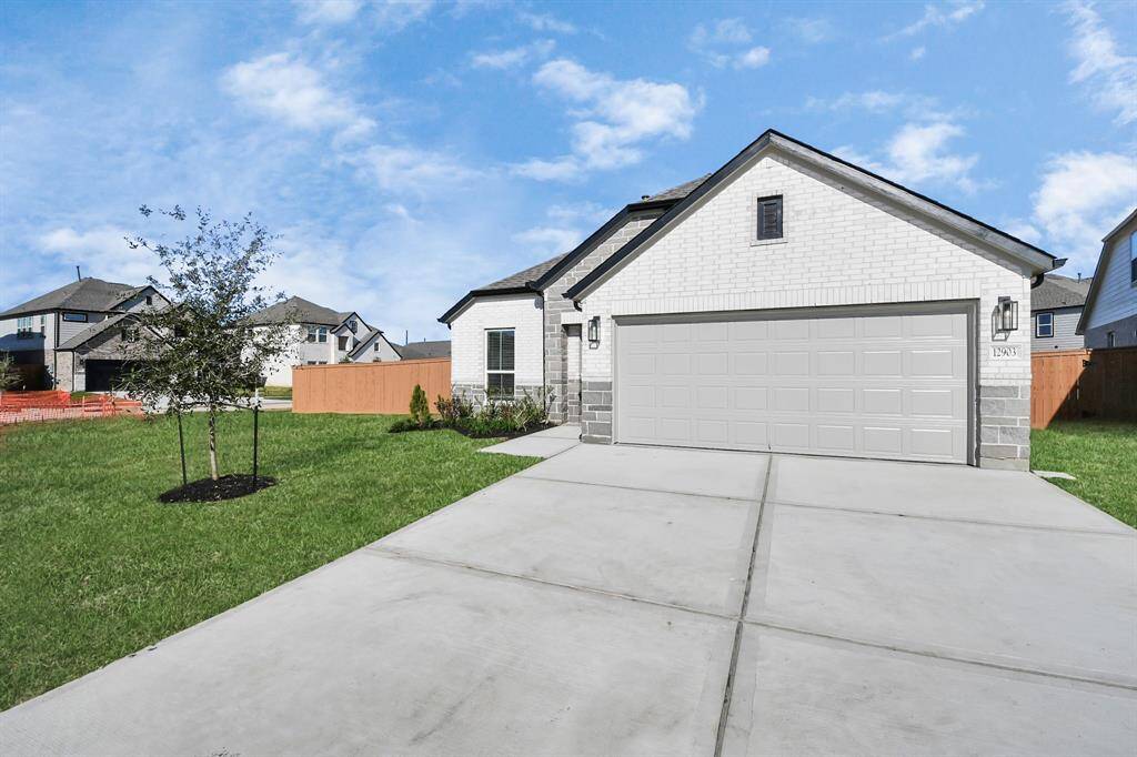 Home features a convenient 2-car garage complemented by aspacious driveway, offering ample parking for you and your guests.