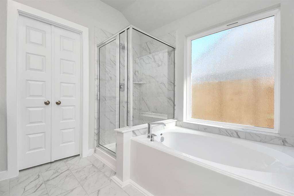 Indulge in a spa-like retreat within the confines of this primary bathroom.