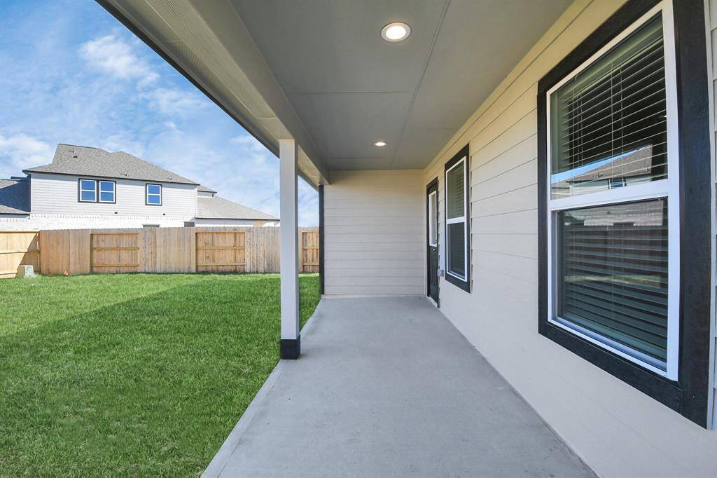 Experience outdoor living at its finest on this expansive covered patio,thoughtfully designed for BBQs and delightful outdoor dining.