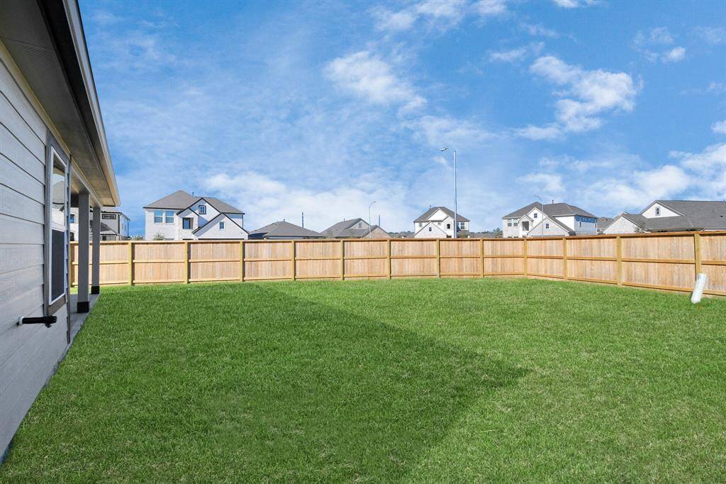 Come and see this spacious backyard with its beautiful covered patio. There is plenty ofroom for the kids to play and adults to relax. Perfect for your outdoor living space, patiofurniture, bbq pit, and so much more. The possibilities are endless!