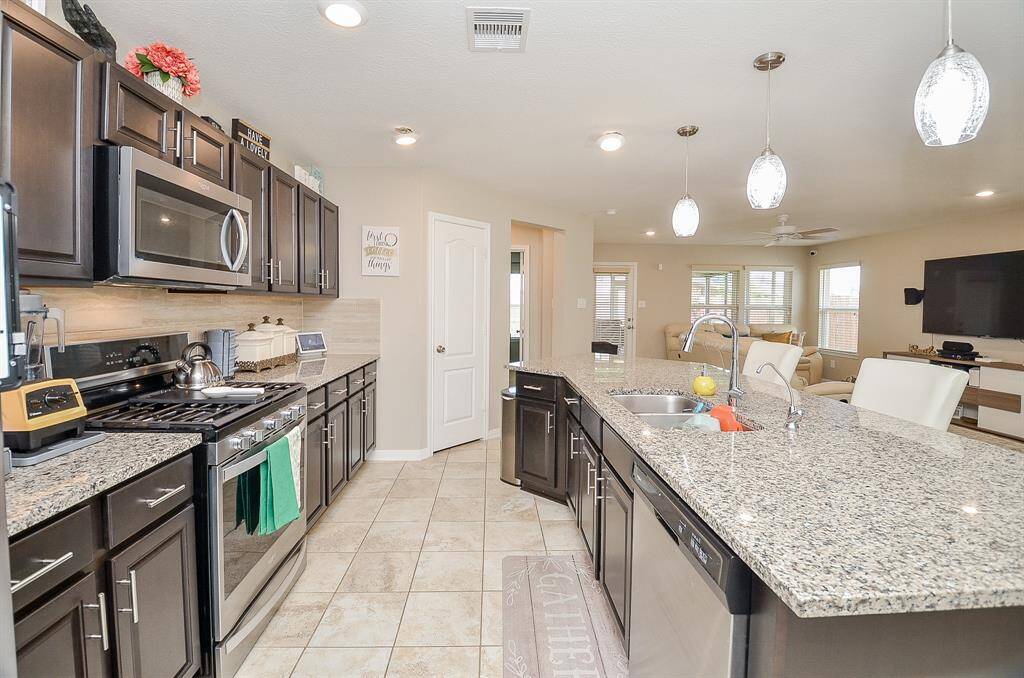 Beautiful kitchen with gas stove for gourmet cooking, island for entertaining