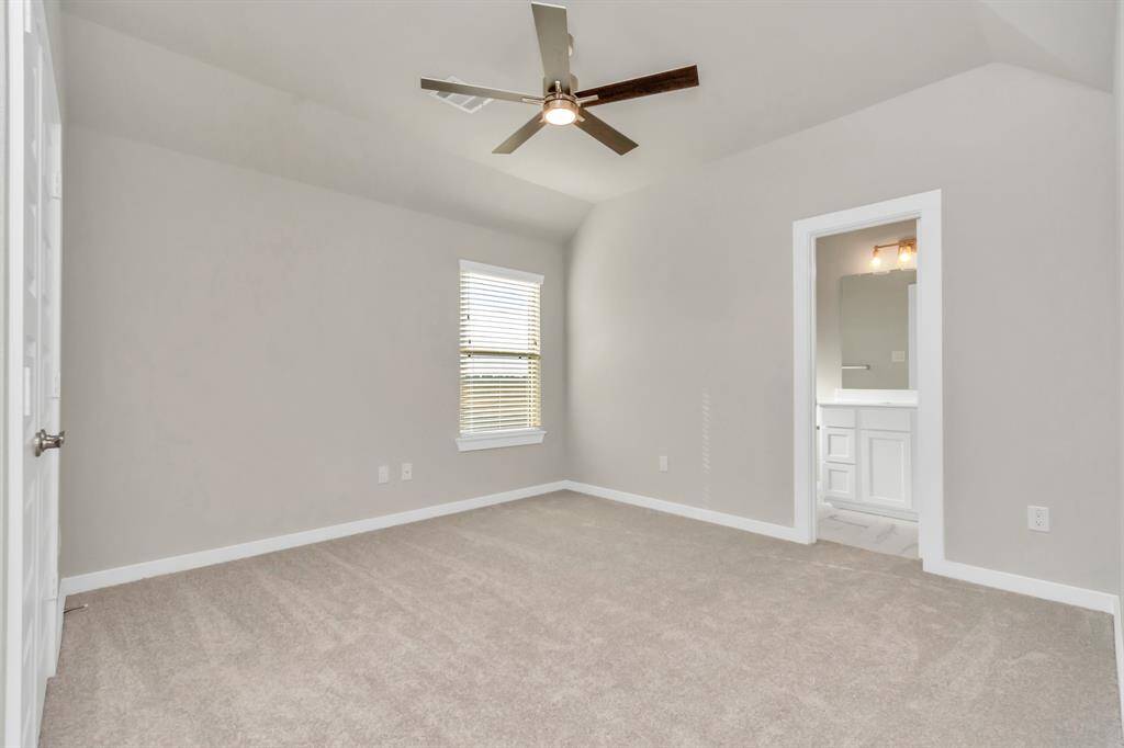 Experience luxury in the generously sized secondary bedrooms, boasting ample closet space, soft and inviting carpeting, large windows welcoming abundant natural light, and the added privacy of blinds for your personal retreat. The indulgence continues with a Jack and Jill bathroom, seamlessly connecting and enhancing the convenience of these  living spaces.  Sample photo, as built color and selections may vary.