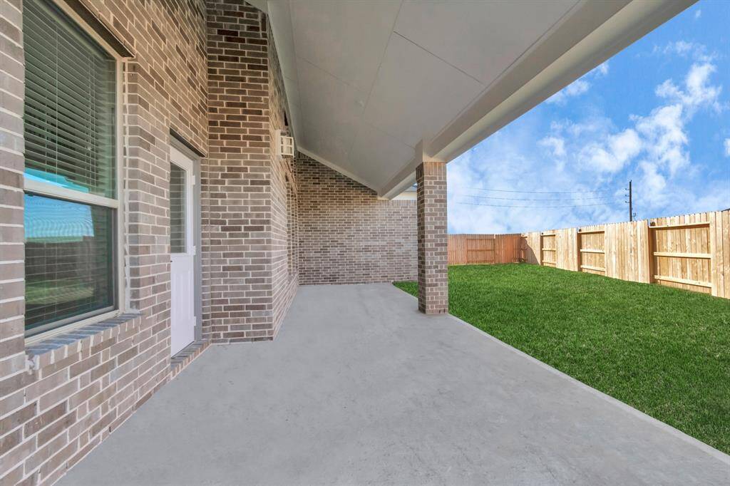 Step into a world of outdoor possibilities in this expansive backyard oasis. A covered patio beckons for relaxation, while the large yard provides ample space for kids to play. Ideal for hosting large barbecue gatherings and outdoor games, this space is a haven for family and friends to enjoy.  Sample photo, as built color and selections may vary.