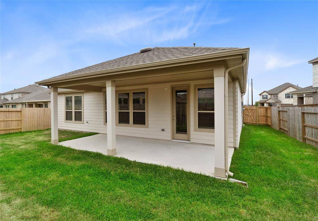 Come and see this spacious backyard with its beautiful covered patio. There is plenty of room for the kids to play and adults to relax!