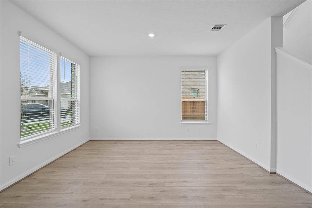 This versatile flex space is perfect for a home office, study, formal dining or creative studio. Flooded with natural light from large windows, it offers a serene and productive atmosphere. The open layout provides endless possibilities for customization, making it ideal for work, relaxation, or hobbies—all while staying connected to the flow of the home.