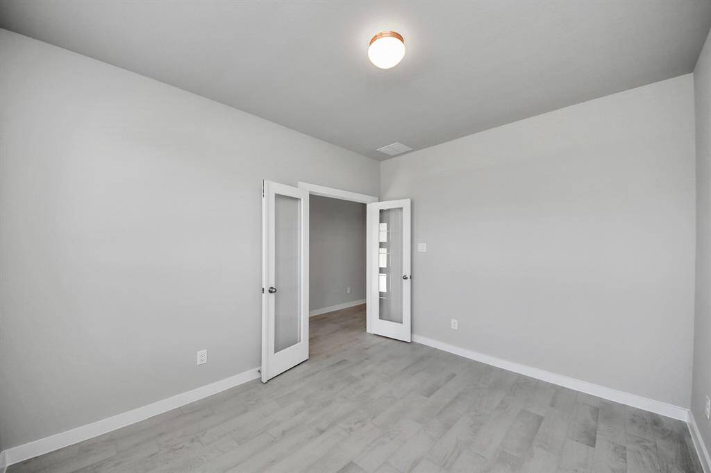 Create lasting memories with your family and friends at the dining table! This expansive dining room showcases sophisticated flooring, custom paint, and seamlessly connects to the family room and kitchen, providing an open and inviting atmosphere.