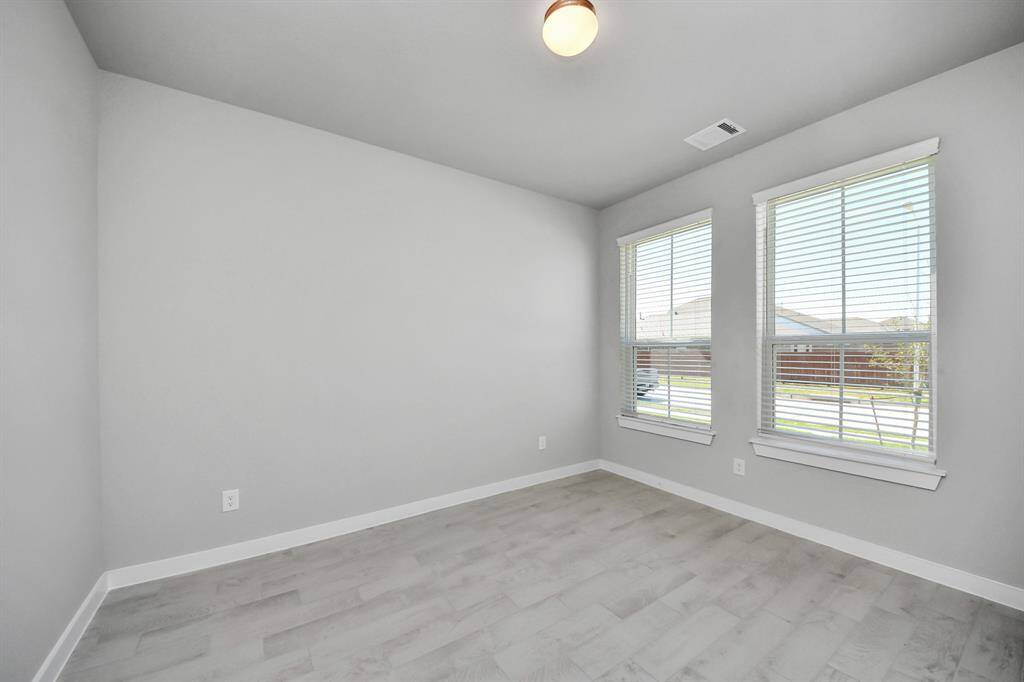 Make memories gathered around the table with your family and friends! This spacious dining room features elegant flooring, custom paint, and adjacent to family room and kitchen for open concept feel.