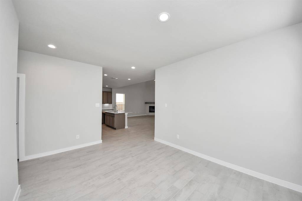 All of this overlooks your expansive family room, creating a perfect space for culinary delights and family gatherings.