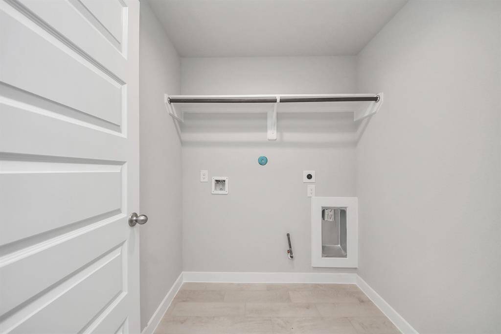 Retreat to the luxurious primary suite, your perfect escape for unwinding after a long day. Located on the first floor, this spacious room features plush carpeting, calming paint tones, high ceilings, and large windows with privacy blinds.