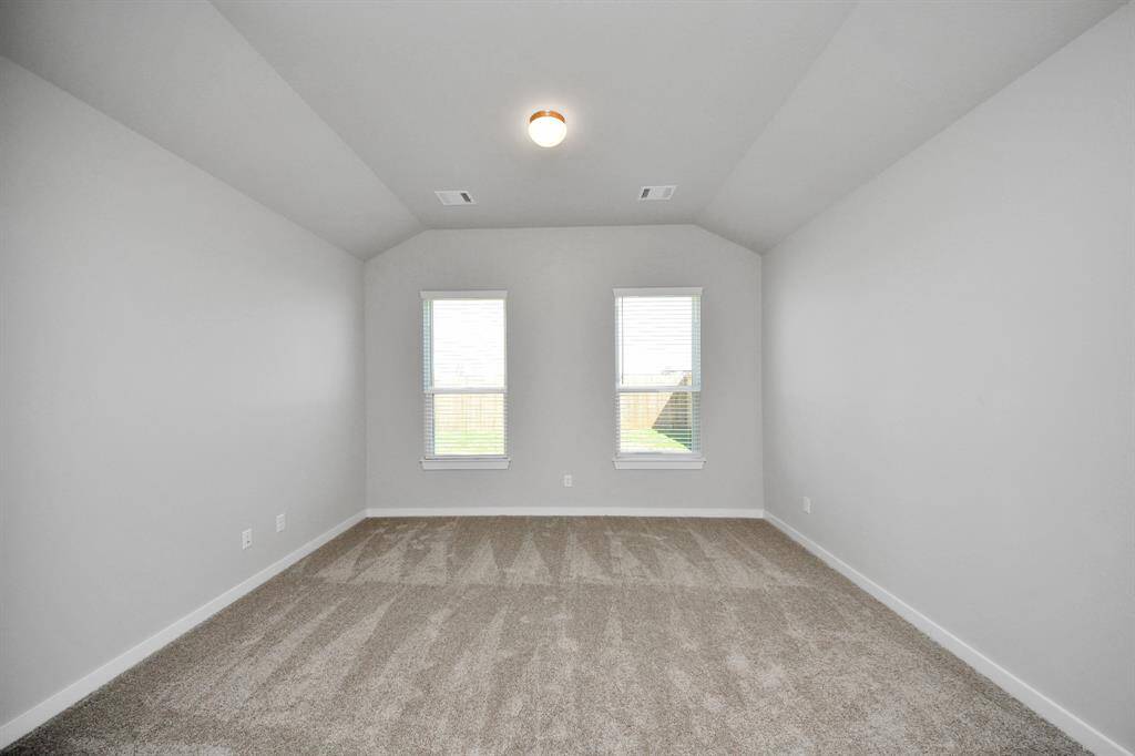 Another perspective unveils a comprehensive view of the serenity and comfort this primary suite offers
