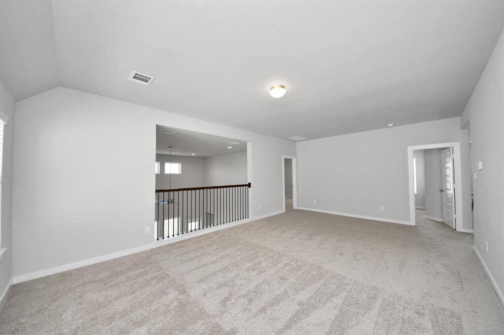 Generously sized secondary bedrooms featuring spacious closets, soft and inviting carpeting underfoot, large windows allowing plenty of natural light, and the added touch of privacy blinds for your personal retreat.