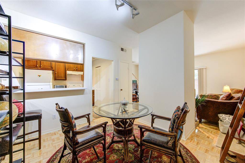 From the breakfast/dining room, you can view the kitchen, which includes a walk-in pantry to the right and a closet nearby. This space seamlessly connects to the living room on the first floor, creating a fluid and functional layout.