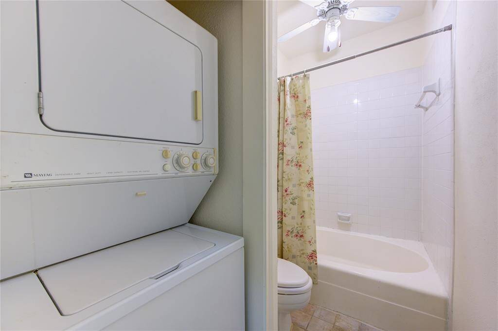 The primary bathroom is thoughtfully equipped with a stackable washer and dryer, adding convenience and efficiency to your daily routine.