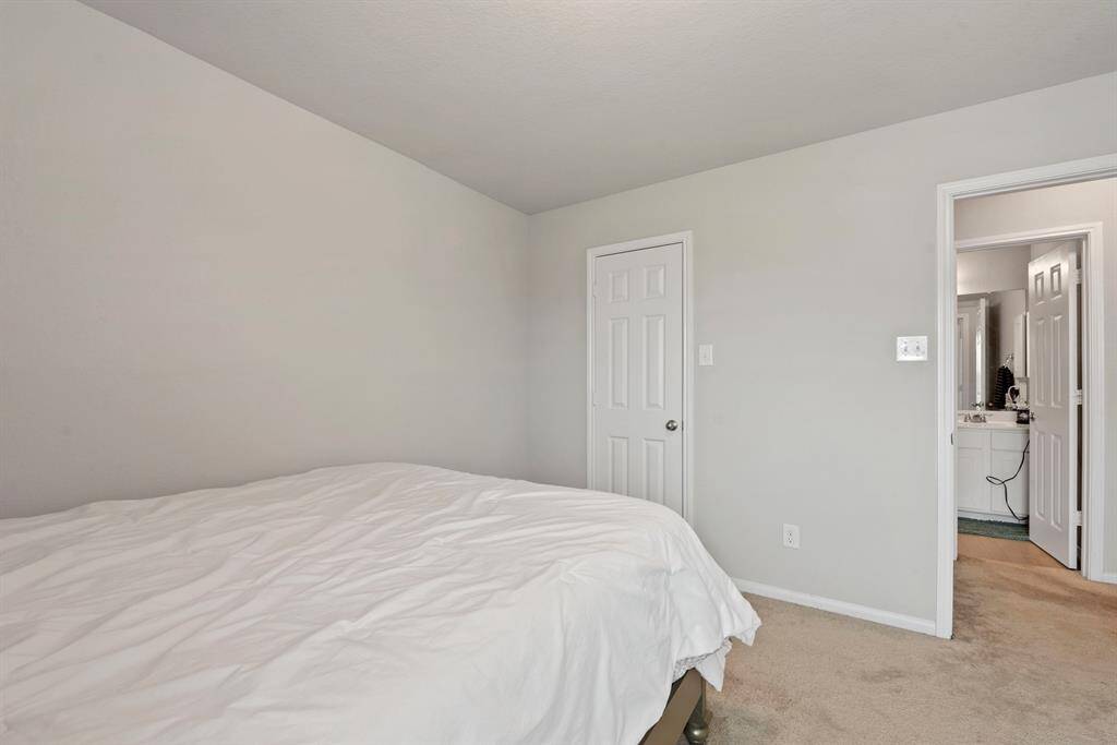 Invision your own style, this bedroom is directly across from the bathroom.