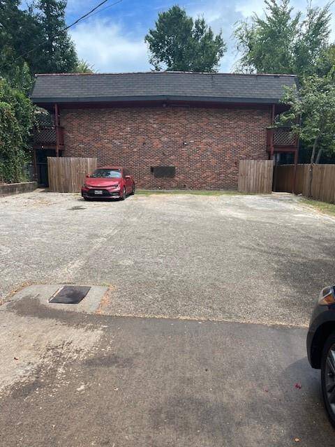 Front view of building and assigned parking lot spaces